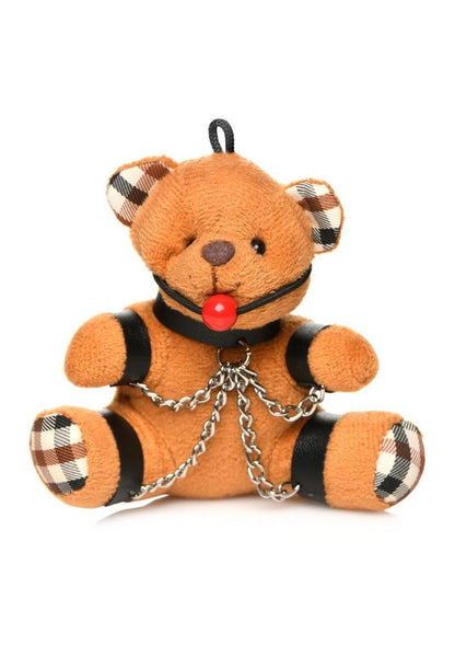 Burnt orange teddy bear keychain with cuffs, chains, and a ball gag, perfect as a gag gift or fun accessory.

gagged teddy bear keychain, BDSM bear keychain, gag gift kinky bear, bondage bear accessory, gagged teddy bag charm, quirky gag gifts, BDSM flagging keychain, teddy bear bondage toy, kinky novelty bear, bondage-themed accessories