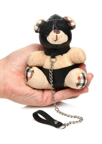 Light peach teddy bear keychain with hood, leather-look panties, and a chain leash, ideal as a gag gift or fun accessory.

hooded teddy bear keychain, BDSM bear keychain, gimp bear gift, bondage teddy bear keychain, kinky gag gifts, leather teddy keychain, teddy bear with chain leash, novelty bear keychain, gimp-themed teddy bear accessory, cheeky bondage gift.