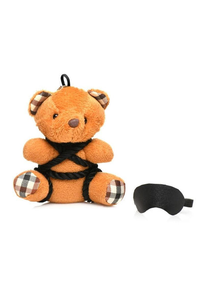 Burnt orange teddy bear keychain tied in silky rope bondage with a removable blindfold, a fun novelty accessory or gift.

shibari teddy bear keychain, rope bondage bear keychain, BDSM novelty gift, bondage bear keychain accessory, kinky teddy bear gift, burnt orange bear keychain, shibari rope bear, playful bondage bear keychain, BDSM-themed keychain gift, novelty shibari bear accessory