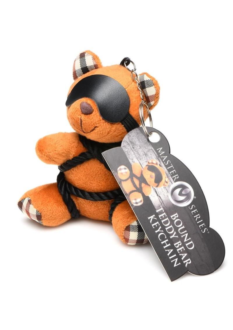 Burnt orange teddy bear keychain tied in silky rope bondage with a removable blindfold, a fun novelty accessory or gift.

shibari teddy bear keychain, rope bondage bear keychain, BDSM novelty gift, bondage bear keychain accessory, kinky teddy bear gift, burnt orange bear keychain, shibari rope bear, playful bondage bear keychain, BDSM-themed keychain gift, novelty shibari bear accessory