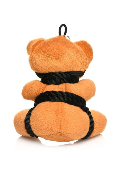 Burnt orange teddy bear keychain tied in silky rope bondage with a removable blindfold, a fun novelty accessory or gift.

shibari teddy bear keychain, rope bondage bear keychain, BDSM novelty gift, bondage bear keychain accessory, kinky teddy bear gift, burnt orange bear keychain, shibari rope bear, playful bondage bear keychain, BDSM-themed keychain gift, novelty shibari bear accessory