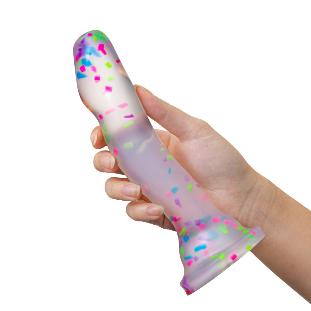 Glow-in-the-dark dildo with neon confetti, crafted from body-safe Purio™ silicone, featuring a curved design, suction base, and playful visual appeal. 
Keywords: glow-in-the-dark dildo, confetti dildo, silicone dildo, suction cup dildo, harness-compatible dildo, body-safe dildo, Purio silicone, G-spot dildo, P-spot dildo, fun adult toy. 