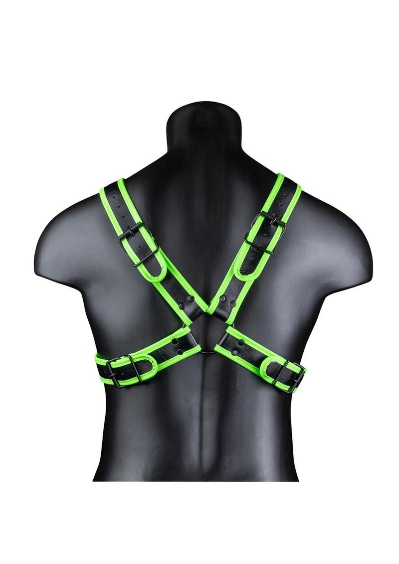 Glow-in-the-dark cross harness with adjustable straps and fluorescent green detailing. Keywords: Ouch Glow in the Dark Cross Harness, glow-in-the-dark harness, fluorescent green harness, adjustable bondage harness, BDSM glow gear, glow-in-the-dark rave harness, men’s bondage gear, cross-style harness, neon kink accessories, glow BDSM harness