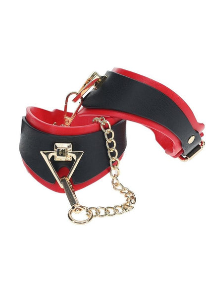 Ouch! Milan Collection Leg Cuffs - Black/Red Black and red bonded leather ankle cuffs with gold chain and decorative accents, designed for stylish BDSM play.