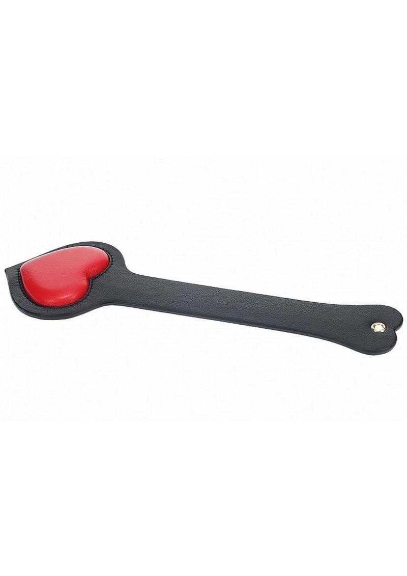 Black bonded leather paddle with a red padded heart-shaped striking end, designed for stylish and playful BDSM use. Ouch! Milan Collection Paddle - Black/Red Milan Collection Paddle, BDSM paddle, heart-shaped paddle, Ouch! paddle, bonded leather paddle, red and black paddle, stylish BDSM gear, Shots Toys warranty, decorative paddle, playful BDSM accessories.