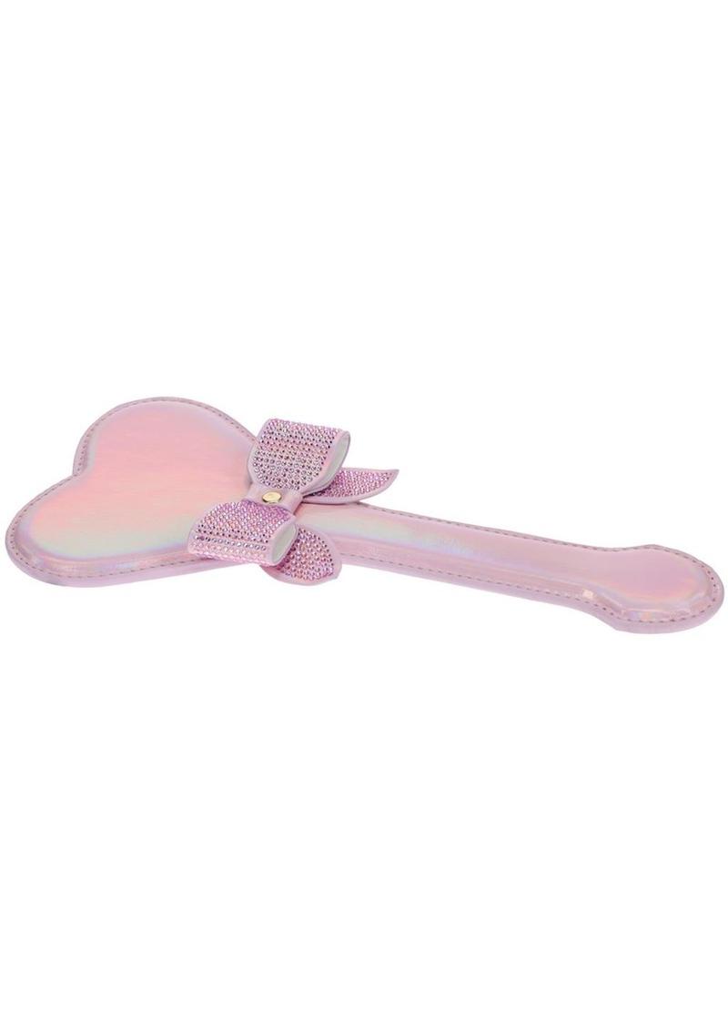 Ouch! Paris Collection Paddle - Pink Heart-shaped paddle with iridescent hardware and rhinestone bow, available in black, pink, and blue for decorative or BDSM use.