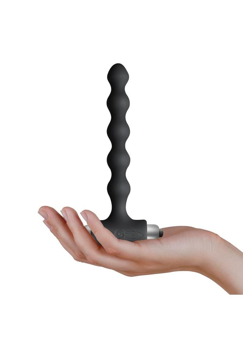 Petite Sensations Pearls Silicone Vibrating Anal Probe - Black Petite Sensations Pearls Black Plug by Rocks Off Toys, vibrating anal beads with 7 functions, velvety silicone, and waterproof design.
vibrating anal beads, beginner anal plug, anal beads for beginners, Rocks Off Toys plug, silicone anal beads, waterproof anal plug, vibrating beads for anal play, 7-function anal beads, T-shaped anal plug.