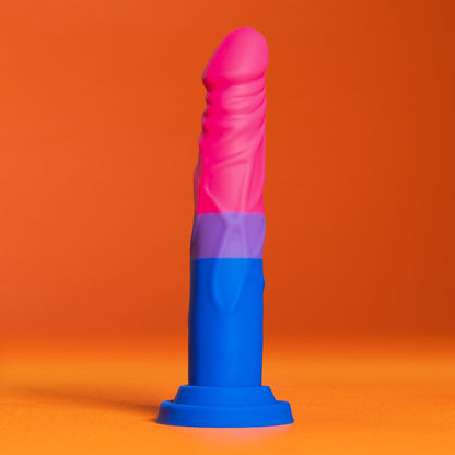 Bisexual pride-colored silicone dildo with a straight shaft, tapered head, and suction base, made from smooth Purio™ silicone.
Keywords: bisexual pride dildo, Avant dildo, straight shaft dildo, tapered head dildo, suction cup dildo, harness-compatible dildo, body-safe silicone dildo, colorful dildo, Purio silicone, artisan-crafted dildo.