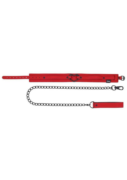 Amor Collar and Leash in red vegan leather with a silver heart embellishment, 36-inch chain leash, and adjustable buckle clasp.

Amor Collar and Leash, vegan leather collar, red collar and leash, BDSM accessories, silver heart collar, adjustable bondage collar, elegant leash set, vegan BDSM gear, passion collar and leash, intimate play accessories.