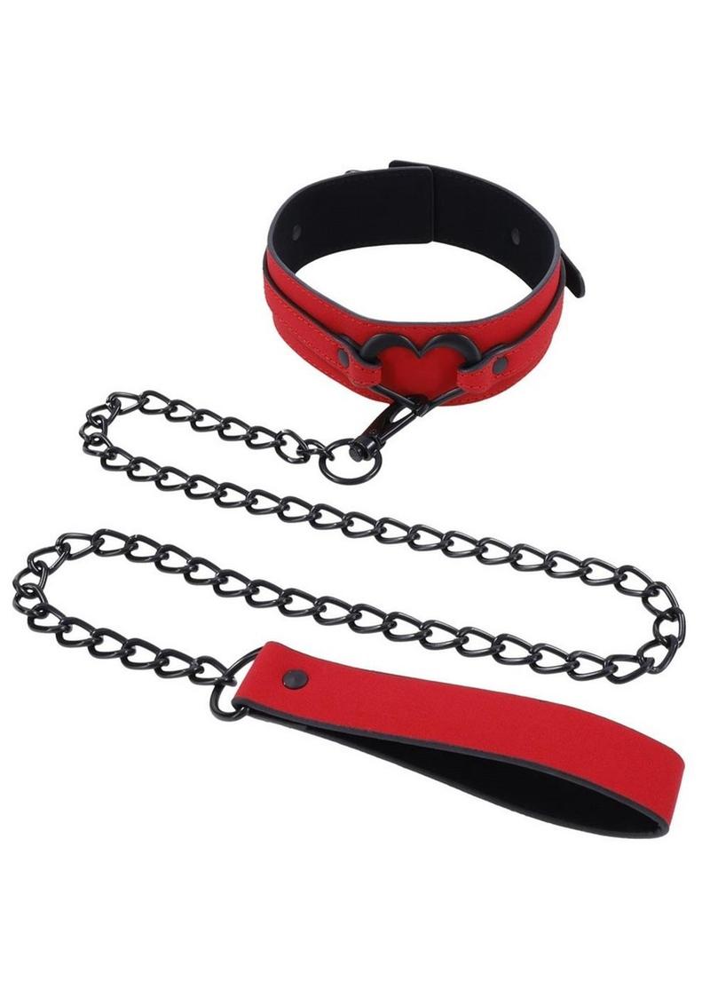 Amor Collar and Leash in red vegan leather with a silver heart embellishment, 36-inch chain leash, and adjustable buckle clasp.

Amor Collar and Leash, vegan leather collar, red collar and leash, BDSM accessories, silver heart collar, adjustable bondage collar, elegant leash set, vegan BDSM gear, passion collar and leash, intimate play accessories.