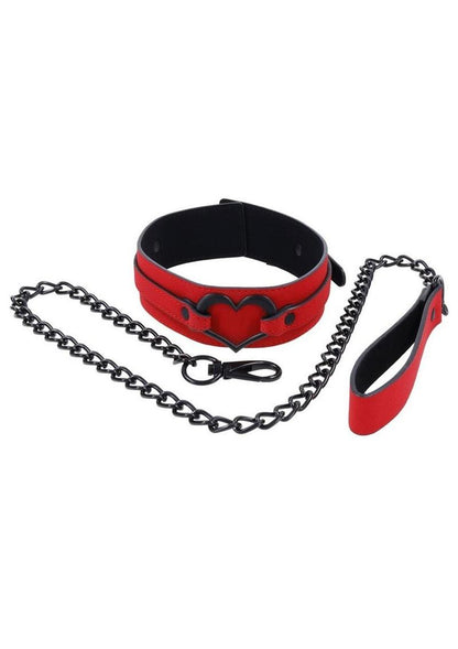 Amor Collar and Leash in red vegan leather with a silver heart embellishment, 36-inch chain leash, and adjustable buckle clasp.

Amor Collar and Leash, vegan leather collar, red collar and leash, BDSM accessories, silver heart collar, adjustable bondage collar, elegant leash set, vegan BDSM gear, passion collar and leash, intimate play accessories.