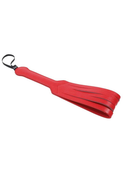 Red vegan leather paddle with looped strands and a wrist strap, designed for impactful strikes and versatile BDSM play.

