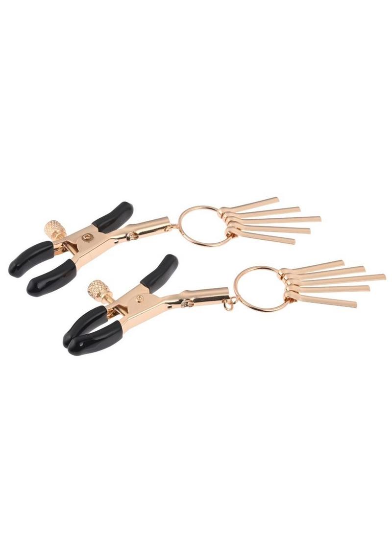 Adjustable gold nipple clamps with rubber tips and elegant dangling rods for sensual play. Keywords: adjustable nipple clamps, gold nipple clamps, Verge clamps, rubber-tipped nipple clamps, elegant BDSM clamps, kink accessories, nipple play tools, nipple clamps for couples, body-safe nipple clamps, gold and black nipple clamps.