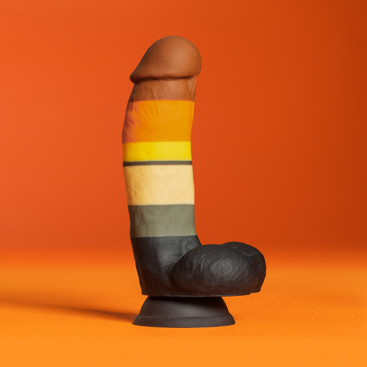 Multi-colored silicone dildo with realistic details, Bear Pride flag, thick girth, and a suction base, made with smooth Purio™ silicone.
Keywords: realistic dildo, Avant dildo, thick girthy dildo, Pride dildo, suction cup dildo, harness-compatible dildo, body-safe silicone dildo, Purio silicone dildo, colorful dildo, artisan-crafted dildo.