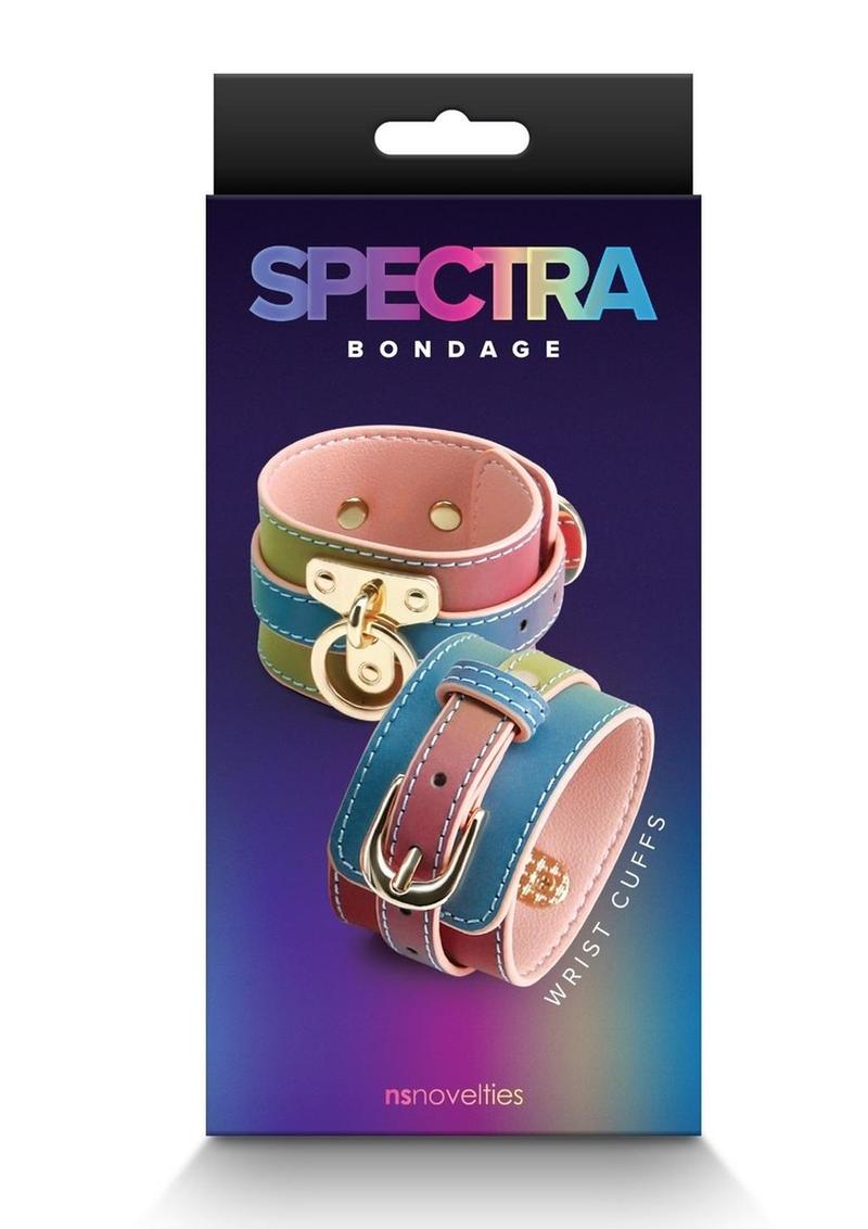 Rainbow bondage wrist cuffs with adjustable faux leather straps and couture hardware for BDSM play.

Keywords: Spectra Bondage Wrist Cuffs Rainbow, rainbow BDSM wrist cuffs, colorful bondage restraints, faux leather handcuffs, NS Novelties wrist cuffs, adjustable BDSM restraints, stylish bondage gear, vibrant fetish cuffs, kink wrist cuffs, rainbow bondage accessories.