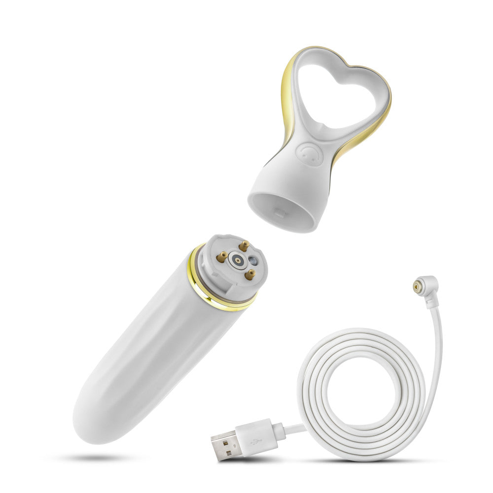 A chic, heart-shaped vibrator with 10 vibration modes, a tapered tip, and a gold-accented handle. Made from soft silicone, it’s splashproof, USB rechargeable, and compact for travel. 
Keywords: Delice vibrator, heart-shaped handle, chic vibrator, Puria silicone, UltraSilk finish, splashproof vibrator, USB rechargeable, travel-friendly vibrator, 10 vibration modes, compact vibrator, body-safe silicone, giftable vibrator