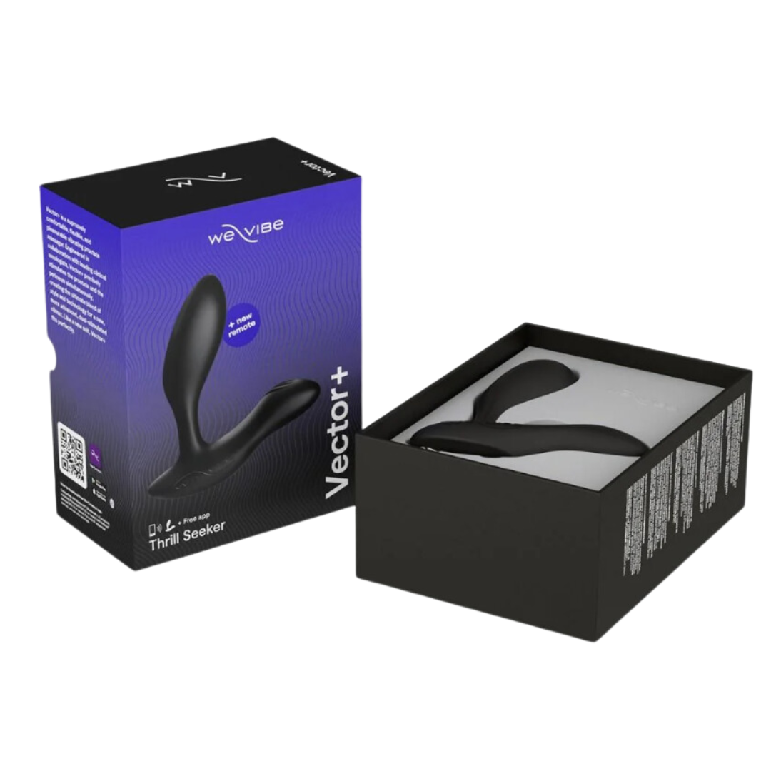 The We-Vibe Vector+ Prostate Massager in black, shown in its packaging with the product box partially open to reveal the device inside.