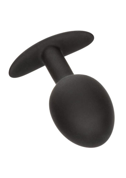 A sleek, black weighted silicone plug with a tapered bulbous design, an ergonomic flared base, and discreet packaging that highlights its 0.57 oz weighted tip and premium body-safe material.