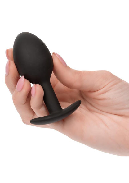 Weighted Silicone Anal Plug - Black A sleek, black weighted silicone plug with a tapered bulbous design, an ergonomic flared base, and discreet packaging that highlights its 0.57 oz weighted tip and premium body-safe material.