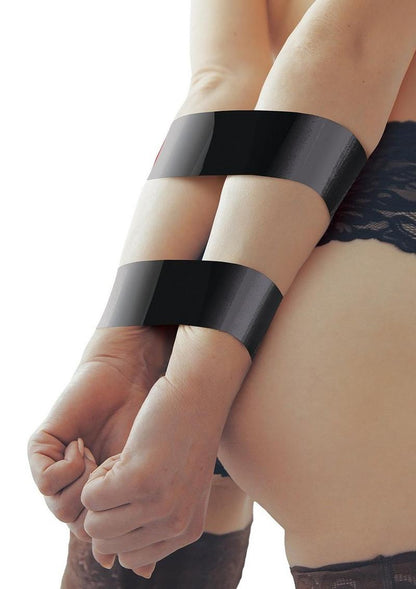 WhipSmart Bondage Tape - Black - 100ft Self-adhesive bondage tape in purple, clear, red, or black with free satin eye mask for versatile kink play. Keywords: bondage tape, self-adhesive tape, no-glue bondage tape, BDSM tape, kink accessories, non-sticky bondage tape, versatile restraints, satin eye mask included, fetish tape, bondage for beginners.