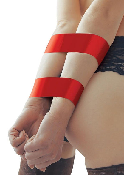 WhipSmart Bondage Tape - Red - 100ft Self-adhesive bondage tape in purple, clear, red, or black with free satin eye mask for versatile kink play. Keywords: bondage tape, self-adhesive tape, no-glue bondage tape, BDSM tape, kink accessories, non-sticky bondage tape, versatile restraints, satin eye mask included, fetish tape, bondage for beginners.