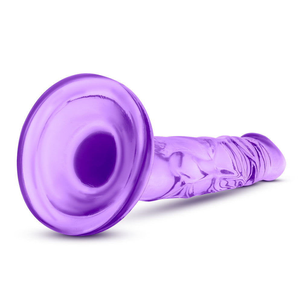 Naturally Yours 5 Inch Mini Cock, slim lifelike dildo with suction cup base and harness compatibility, available in pink or purple.

slim dildo, beginner-friendly dildo, pink dildo, purple dildo, harness-compatible toy, suction cup base, body-safe TPE, pegging dildo, realistic slim dildo, beginner anal toy