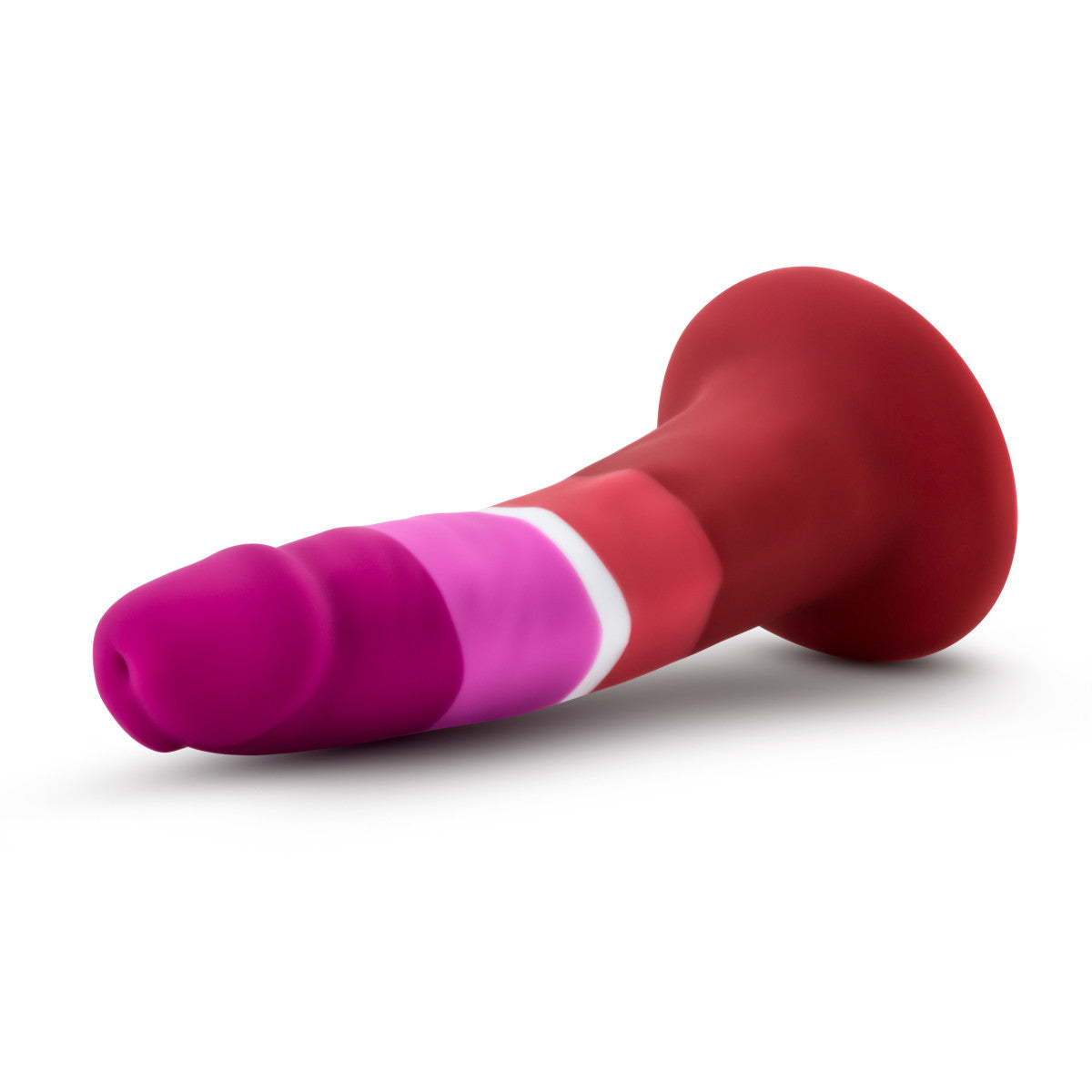 Lesbian pride-colored silicone dildo with a petite design, straight shaft, and suction base, made from smooth Purio™ silicone. Keywords: lesbian pride dildo, Avant dildo, petite dildo, beginner-friendly dildo, suction cup dildo, harness-compatible dildo, body-safe silicone dildo, colorful pride dildo, Purio silicone, artisan-crafted dildo.
