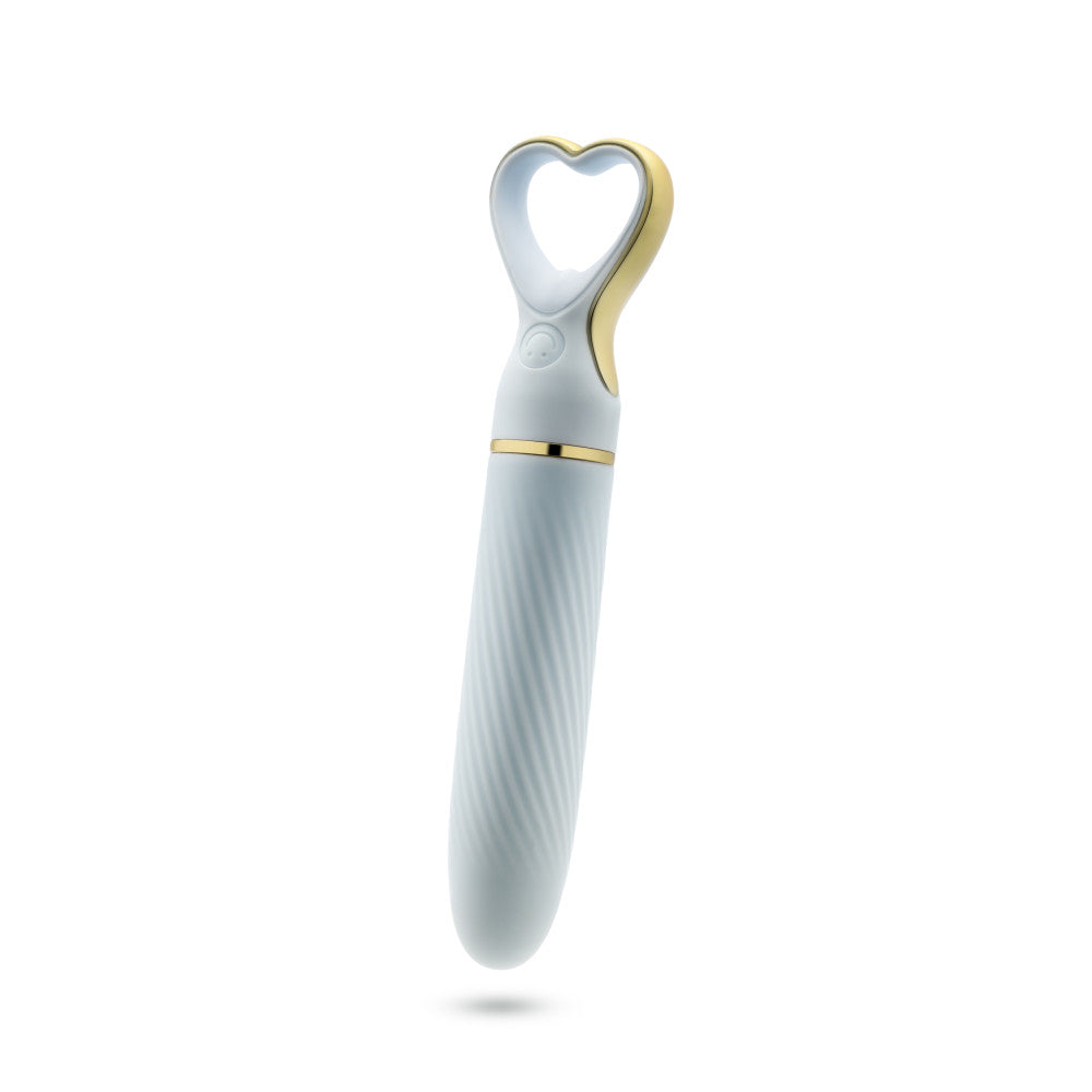 A chic, heart-shaped vibrator with 10 vibration modes, a tapered tip, and a gold-accented handle. Made from soft silicone, it’s splashproof, USB rechargeable, and compact for travel. 
Keywords: Delice vibrator, heart-shaped handle, chic vibrator, Puria silicone, UltraSilk finish, splashproof vibrator, USB rechargeable, travel-friendly vibrator, 10 vibration modes, compact vibrator, body-safe silicone, giftable vibrator