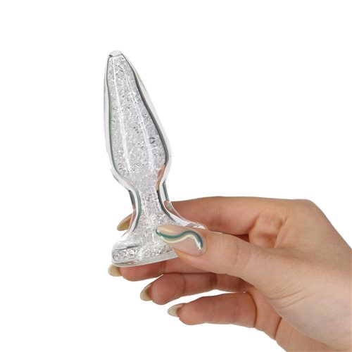 Luxurious, safe, and easy to clean for elegant pleasure. Clear glass anal plug with shimmering bead interior, gem base, and sleek design for temperature play and elegant anal exploration. Keywords: glass anal plug, borosilicate glass plug, sparkling anal plug, luxury anal toy, sculpted gem base plug, temperature play toy, beginner-friendly anal plug, body-safe anal plug, easy-to-clean glass toy, PowerBullet anal plug.