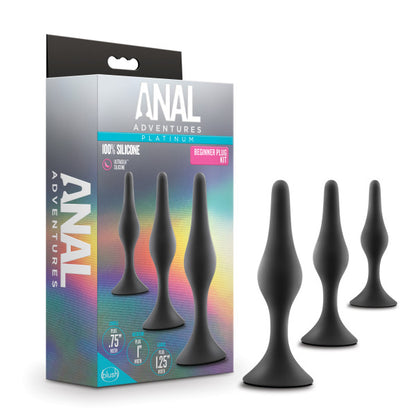 Product shown next to packaging. Three teardrop shaped butt plugs black silicone with flared base. Beginner-friendly silicone plug kit with three sizes, StayPut™ base, and tapered design for safe and smooth anal play.

beginner anal plug kit, silicone plug set, graduating anal plugs, tapered tip anal plugs, StayPut base, body-safe silicone plugs, smooth anal plugs, Puria platinum-cured silicone, Ultrasilk finish plugs, water-based lubricant safe